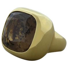 A simple yet over the top cocktail ring featuring a 22.57 carat smoky quartz. The cushion cut smoky quartz is bezel set in an 18K yellow gold setting. A bold ring that will surely impress. Ring Size 6.5 (Sizable) Suzanne Belperron, Top Cocktails, Bold Rings, Vintage Style Rings, Gold Cocktail Ring, Contemporary Ring, Gold Cocktail, Yellow Gold Setting, Contemporary Jewellery