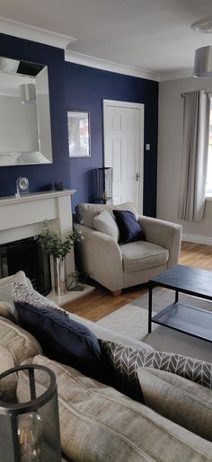 a living room filled with furniture and a fire place