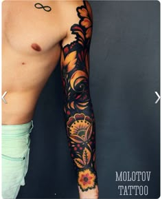 a man's arm with tattoos on it and an orange flower in the middle