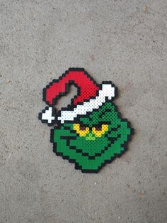 a piece of pixel art that looks like an elf's hat on the ground