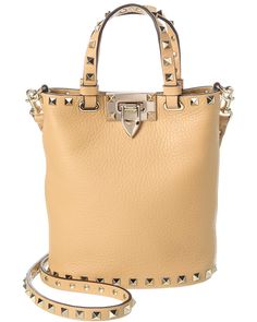 About The Brand: Signature Elegance With A Modern Aesthetic. Made In Italy Rockstud Grainy Leather Crossbody In Nude Grainy Leather With Platinum-Finish Rockstuds Interior Design Details: Suede Lining, Card Slots Measures 6.5In Wide X 7.5In High X 3.5In Deep Top Handles Drop 4In Adjustable And Removable Shoulder Strap Drops 22In Turnlock Closure Please Note: All Measurements Were Taken By Hand And Are Approximate; Slight Variations May Occur. Our Products Are 100% Genuine. In Some Cases We Purchase Merchandise From Trusted Independent Suppliers And Not Directly From The Brand Owner. In All Cases We Stand By The ity Of Every Product Sold On Our Site. Interior Design Details, Brand Owner, Valentino Rockstud, Modern Aesthetic, Medium Bags, Cross Body Handbags, Leather Crossbody, Design Details, Designing Women