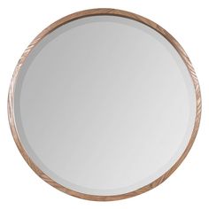 a round mirror with wood trim around it