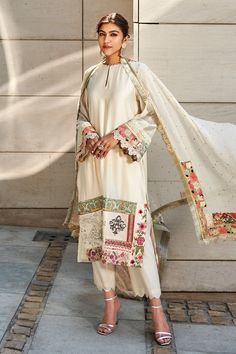 Ivory chanderi kurta enhanced with patchwork embroidered panel. Paired with ivory chanderi trousers and a georgette dupatta accentuated with mukaish, lace and patchwork border.
Component: 3
Pattern: Embroidered
Type Of Work: Patchwork
Neckline: Loop Keyhole Neck
Sleeve Type: Long Sleeves
Fabric: Kurta and Trouser-Chanderi, Dupatta-Georgette
Color: White
Other Details: 
Embroidered dupatta
Loop neckline
Scallop borders
Occasion: Wedding - Aza Fashions Varun Bahl, Georgette Tunics, Chanderi Kurta, Georgette Dupatta, White Kurta, Keyhole Neck, Kurta With Pants, Kurta Set, Embroidery Details