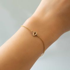 This dainty Love knot bracelet is the perfect friendship gift or gift for her. Gold Filled Love Knot Diameter 1/4in (6mm) Chain Length: 6-7.5in (15-19cm) Lobster Clasp Handcrafted in NYC Hypoallergenic, lead and nickel free #B312-GF Dainty Infinity Bracelets For Friendship, Dainty Infinity Bracelet For Everyday Wear, Dainty Infinity Bracelet For Friendship, Dainty Infinity Bracelet For Everyday, Minimalist Rose Gold Chain Bracelet For Friendship, Rose Gold Hypoallergenic Charm Bracelet For Friendship, Dainty Adjustable Heart Bracelet For Promise, Dainty Heart Bracelet For Promise, Bracelets With Spring Ring Clasp As Gift