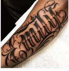 a man's arm with the word tattoo on it