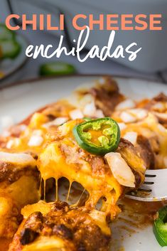 a white plate topped with cheesy enchiladas covered in cheese and jalapenos