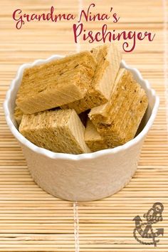 there are several pieces of food in the bowl on the table and one is cut into cubes