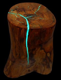 a wooden stool with blue light on it