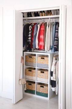 an organized closet with clothes and baskets