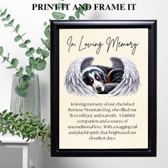 a dog with angel wings on it's head is framed in a black frame