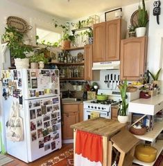 a kitchen filled with lots of furniture and decor