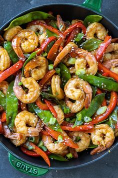 stir fry with shrimp and peppers in a skillet