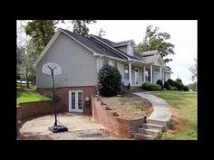 a house with a basketball hoop in the front yard