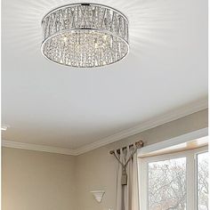 a chandelier hanging from the ceiling in a bedroom