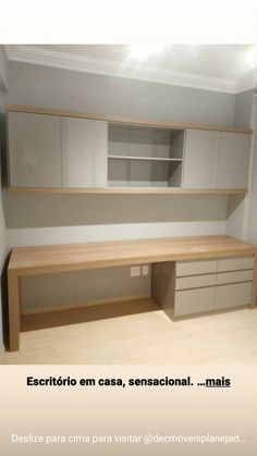 an empty room with cabinets and drawers in it