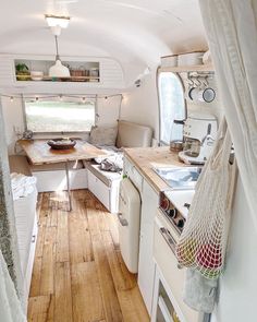 the interior of an rv is clean and ready to be used as a camper