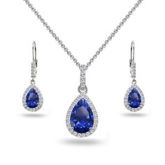 PRICES MAY VARY. FEATURE - Wear this stylish set to enhance your daytime and evening attire. This beautiful jewelry set features dangling pear-cut created blue sapphire gemstones in a white topaz encrusted halo design, for a dazzling evening look. The earrings measure 9.5mm in width & 11.6mm in length and the pendant measures 11.5mm in width & 25mm in length. CRAFTED - This luxurious jewelry set is crafted of fine sterling silver and is nickel & tarnish free. The pendant hangs from a 18 inch rol Dangling Necklace, White Topaz Necklace, Luxurious Jewelry, Halo Design, Topaz Jewelry, Topaz Necklace, Leverback Earrings, Teardrop Necklace, Zirconia Earrings