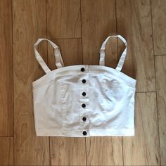 White Buttoned Crop Top From Forever 21 -Never Worn, Excellent Condition -Size Medium, But Can Fit A Size Small Too -White Fabric W/ Brown Button Closure -Can Ship Asap (1-2 Days) -Adjustable Straps Can Sell For Cheaper Shipping Price On D3p0p :) Message Me Similar To Brand Melville Urban Outfitters Pacsun John Galt White Summer Crop Top For Everyday, White Everyday Crop Top For Summer, White Crop Top Tank For Day Out, Forever 21 Cotton Crop Top Tank Top, Forever 21 White Spring Tank Top, Forever 21 White Summer Crop Top, Forever 21 White Tank Top For Spring, White Forever 21 Beach Top, Chic White Everyday Crop Top