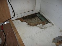 a bathroom floor that has been removed from the wall