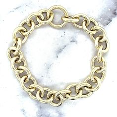 "➣ High quality 14K Yellow Gold 12mm Round Link Bracelet with Push Lock Clasp, 7.5\" Real Gold Bracelet, Chuncky Circle Link Bracelet, Women ➣ MATERIAL: 14K Yellow Gold  ➣ Closure: Push-in   ➣ Weights:  Bracelet - 7.5\" - 9 grams Necklace - 18\" - 19.6 grams  ◈ Please note that weights are approximate. ➣ If you need a specific length, please message us. Explore more gold bracelets. https://www.etsy.com/shop/MarinaMJewelry?ref=seller-platform-mcnav&search_query=gold+bracelet ➣ SHIPPING: ◈ We always offer domestic FREE SHIPPING via USPS first class (3-5 business days)  ◈ We ship internationally, shipping costs are shown at checkout.     Please be aware that the buyer is responsible for any international customs & duties. ◈ Orders shipped from NYC usually within 24-48 hours from receiving pay Gold Chunky Chain Bracelet, Yellow Gold Chain Link Bracelet With Polished Finish, Gold-plated Chunky Chain Bracelet With Oval Links, Gold-tone Solid Link Round Bracelet, Gold-tone Chain Link Bracelet With Solid Links, Yellow Gold-plated Link Bracelet, Real Gold Bracelet, Real Gold, Chain Link Bracelet