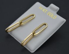 Show off your sophisticated sense of style with these unique Double Paperclip Drop Dangle Earrings. Crafted from 14K yellow solid gold and weighing 1.4 grams, these earrings will leave a lasting impression that will turn heads wherever you go. Their shiny finish will sparkle and shine in any light, making them perfect for day or evening wear. Whether you're going for a classic, understated look or making a bold statement, these earrings are the perfect combination of modern flair and timeless el Gold Drop Earrings, Paper Clip, Evening Wear, Jewelry Earrings Dangle, Solid Gold, Women's Earrings, Etsy Earrings, Dangle Drop Earrings, Dangle Earrings