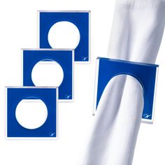 three pieces of white and blue napkins with circles on each side, one in the middle