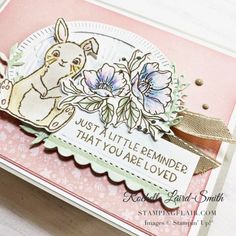 a close up of a card with an animal and flower design on it, which reads just a little reminder that you are loved