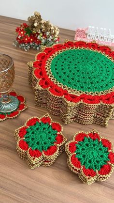 crocheted doily and coasters sitting on a table