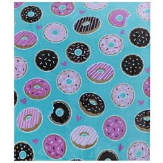 a blue background with pink and black donuts on it