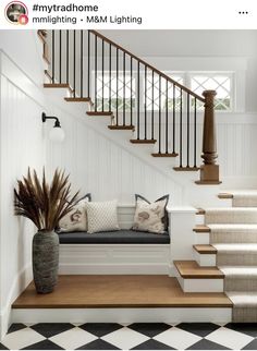 a white staircase with black and white checkered flooring next to a potted plant