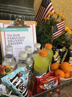 a basket filled with drinks and snacks next to a sign that says, thank you to our fabulous drivers