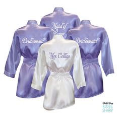 three bridesmaid robes in purple and white with the words maid of paris on them