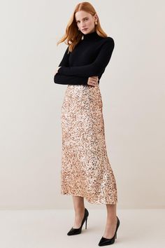 A Combination Of Femininity And Glamour, The By Lydia December '22: An Exploration Of Beauty Collection Showcases Sartorial Elegance Through Elevated Everyday Staples Alongside Luxe Evening Styles.Ensure You'Re Party-Ready This Season In This Gleaming Sequin Skirt. Rose Gold Sequins Glisten With Every Ray Of Light, Creating A Truly Showstopping Effect. Pair This Skirt With A Rollneck Jumper And Stiletto Heels For A Luxurious Desk-To-Bar Look.Rose Gold Sequinsmaxi Hemlineinvisible Rear Zipthis Is Elegant Spring Maxi Skirt For Night Out, Glamorous Night Out Dress With Lined Skirt, Winter Party Midi Length Skirt, Fitted Pencil Skirt For Night Out And Party Season, Winter Pencil Skirt For Night Out, Glamorous Fitted Pencil Skirt, Feminine Party Pencil Skirt With Lining, Glamorous Pencil Skirt For Night Out, Evening Fall Pencil Skirt