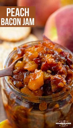 peach bacon jam in a glass jar with a spoon