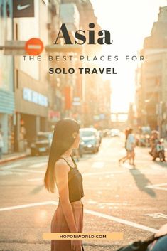 a woman standing in the middle of a street with her back to the camera and text overlay reads asia the best places for solo travel