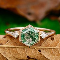 Ring Details: Metal Type: 925 Sterling Silver, Soild 10k Gold, Solid 14k Gold,and Solid 18k Gold Center Stone: Natural Moss Agate Center Carat Weight: Hexagon Cut 1.35CT (7mm) Side Stone: Moissanite Side Carat Weight: Kite Cut 0.22ctw Band Width: 1.5mm SKU: MHR0112X-GH Accessories: *Shipped with beautiful ring box; *Directly price from Manufacturer, 1/3 the price from Jewelry Store; - Ethically Sourced Hexagon Gemstone Jewelry In 14k Gold, Gold Moss Agate Ring, Moissanite Ring Set, Moss Agate Engagement Ring, Red Garnet Ring, Rutilated Quartz Ring, Agate Engagement Ring, Moss Agate Ring, Cushion Cut Ring