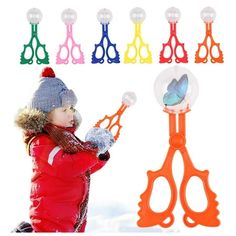 a young child is playing with scissors and snowballs in front of the image,