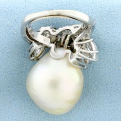 In Platinum. Contains one high quality natural extremely large 20x17mm Baroque Pearl, with excellent luster. Also contains seven high quality 8.5 x 4.5mm marquise cut and eight 3 x 1.5mm baguette cut Diamonds, 4ct TW, SI clarity/G color. Size 5 1/2. 14.9g Inventory 14404 Statement Rings Diamond, Three Stone Diamond, Baguette Cut Diamond, Baguette Cut, Marquise Cut, Baroque Pearls, White Gold Rings, Diamond Wedding, Statement Ring