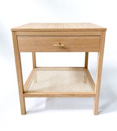 a small wooden table with one drawer open