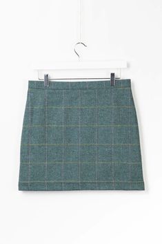 Embrace classic elegance with the Helmsley Tweed Skirt in dark green tweed. This sophisticated skirt features a timeless tweed pattern, providing a refined and polished look perfect for both casual and formal occasions. The high-quality fabric ensures durability and comfort, while the flattering cut enhances your silhouette. Pair it with a blouse or sweater for a chic, stylish ensemble that stands out with its traditional yet modern appeal. Decorative Trellis, Halloween Costume Mask, Halloween Arts And Crafts, Tweed Pattern, Green Tweed, Playset Outdoor, Puzzle Shop, Wool Shop, Tweed Skirt