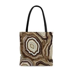 Tote Bag, Brown Tote Bag, Marble Tote Bag, Brown Tote, Marble Tote, Agate Tote Bag, Geode Tote Bag, Gifts Under 20 This beautiful, high-quality tote bag is available in three sizes. An all over print and durable, soft materials combine comfort with style at whether you're at the beach or out in town. Created from my artwork, 'Beige Agate'. * 100% Polyester -- Extremely strong and durable synthetic fabric that retains its shape and dries quickly * Boxed corners * Black inner stitching, transparent thread on hems. * Black cotton handles with reinforced stitching * Non-woven laminate inside, easy to clean  *  Small = 13" x 13", Medium = 16" x 16", Large = 18" x 18" Beige Rectangular Bag For Gift, Brown Handheld Bag For Gift, Beige Square Bag As A Gift, Square Beige Bag For Gift, Beige Square Bag For Gift, Large Beige Bag For Gift, Beige Tote Satchel For Gifts, Beige Satchel Tote, Beige Satchel Tote For Gifts