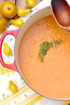 a pot filled with soup sitting on top of a table