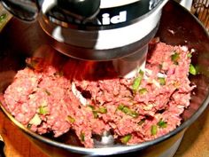 the meat is being processed in a bowl