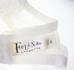 "Vintage bridal white garter belt by Felina Lingerie. Sheer lace front, 4-leg garter with adjusters. New old stock flawless condition. Lace: 70% nylon 16% Spandex 5% Rayon Marked M/L (1) Item Final Sale-No Returns Offered SHIPPING POLICY I am not responsible for the item after it ships. Condition Statement: It is very rare to find flawless vintage items. In the unlikely chance I missed describing any minor imperfections please consider your purchase \"as is\" with the knowledge that each sale is Vintage Garter Belt, White Garter Belt, White Garter, Vintage Garter, Leg Garter, Garter Belts, White C, Vintage Bridal, Socks And Hosiery