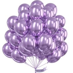 a bunch of purple balloons are in the air