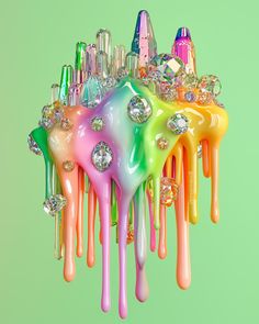 a multicolored chandelier hanging from a green wall with lots of crystals