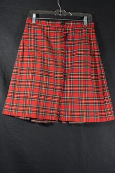 "This is a classic red Tartan plaid skirt made in a material that is medium weight and it has a wool-blend feel to the touch, but there's no label for material. The skirt is flat on one side with intentional frayed/fringe edge and pleated around one side and around the back. There is a vintage Colette label. It is in good pre-loved vintage condition. Great for the holidays, preppy, punk, school girl and/or classic looks! Check out the photos. --measurements taken laid flat (double for circumfere 1980s Punk Fashion, 1980s Punk, Preppy Goth, Wool Plaid Skirt, Tartan Mini Skirt, Goth Skirt, Red Plaid Skirt, Alt Outfits, Classic Skirts