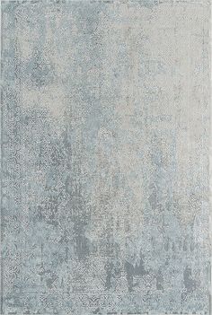 an area rug with grey and white colors