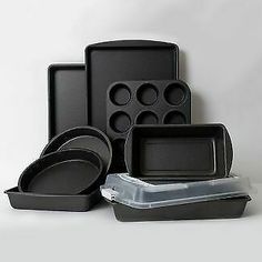 an assortment of baking pans and muffin tins