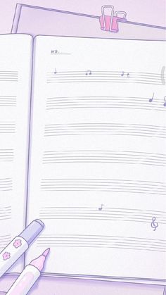 an open book with music notes and pencils next to it